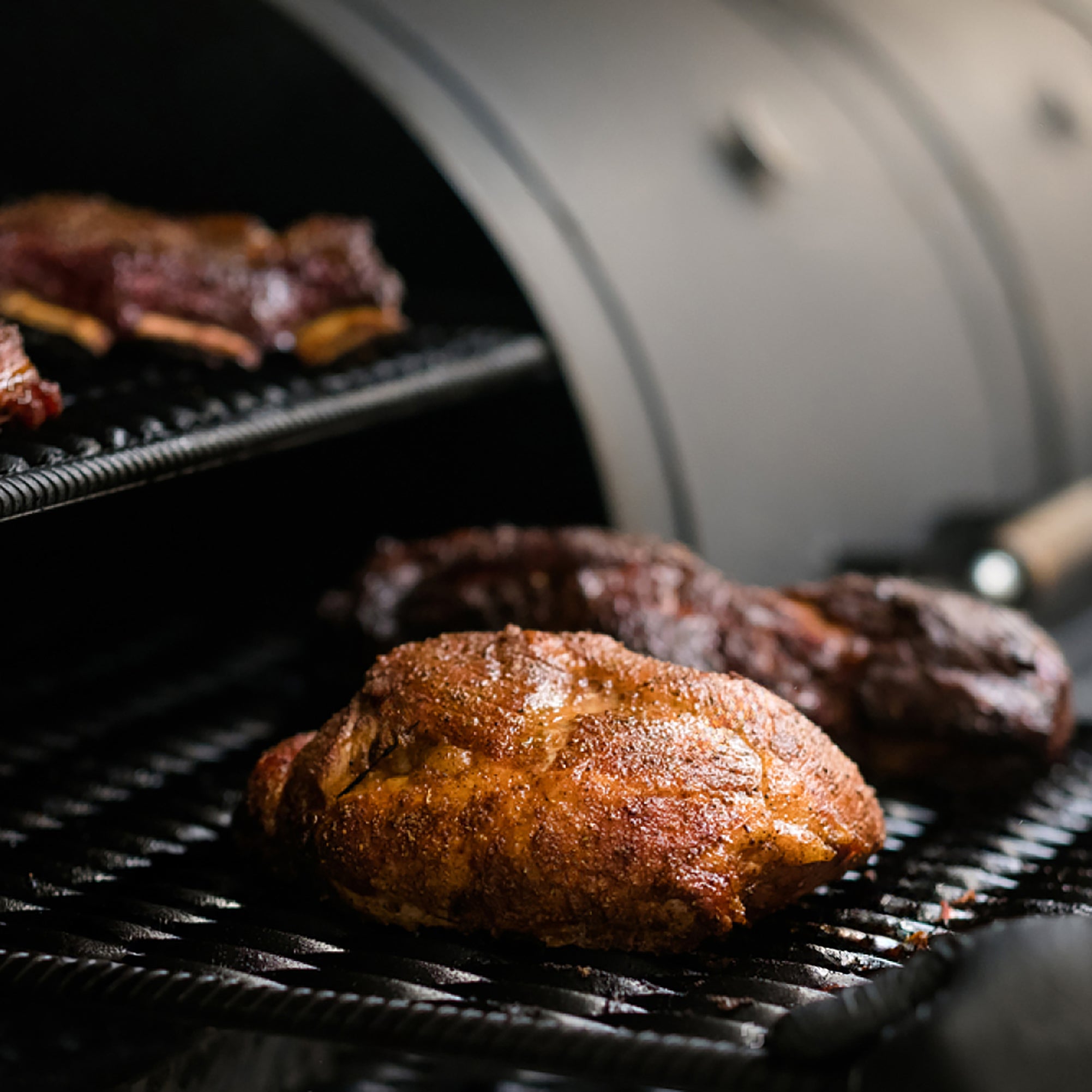 grill restaurant kitchen chef cooking beef and pork meat in bbq-smoker