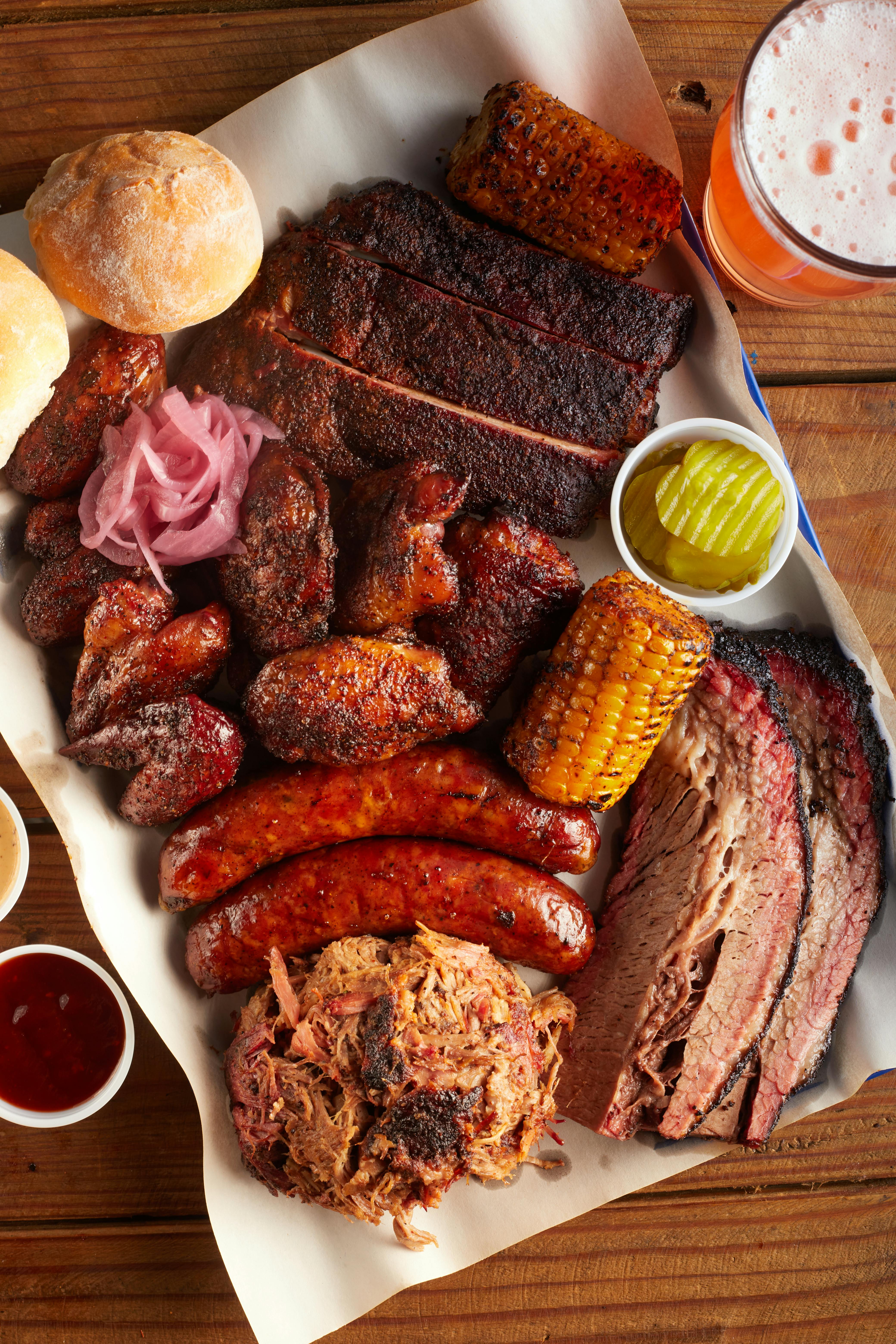 brisket, pulled pork, sausages, chicjken wings from grill, bbq